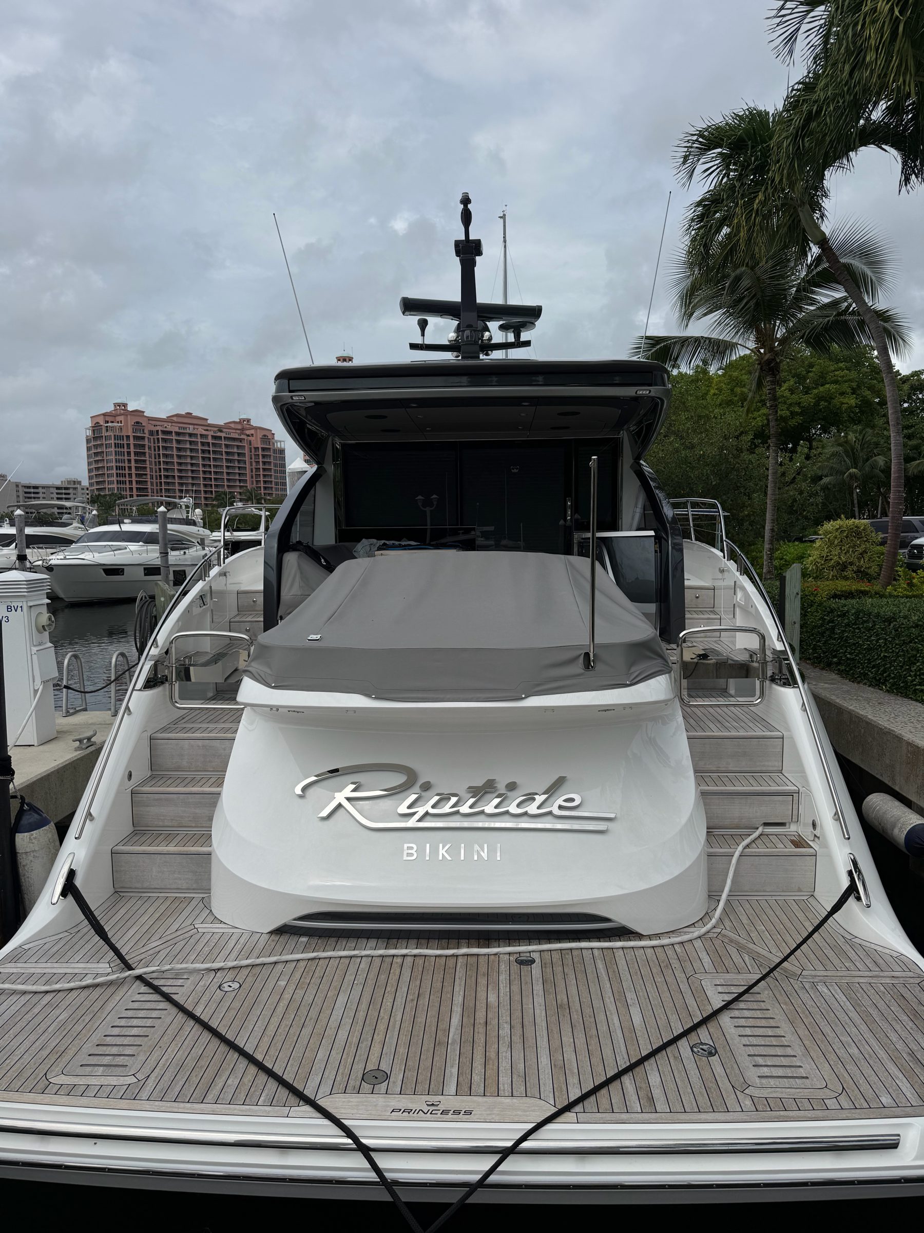 Riptide with BIKINI home port in polished stainless script on a Princess yacht transom, daylight